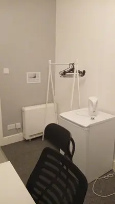 a white room with a chair and a radiator at Single Room with Private Bath Free Street Parking Near LFC No Breakfast in Liverpool