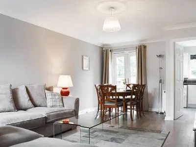 a living room with a couch and a table at Church View in Longridge