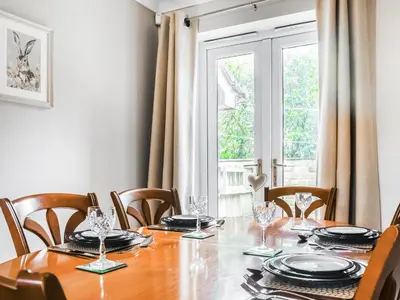 a dining room with a table and a window at Church View in Longridge