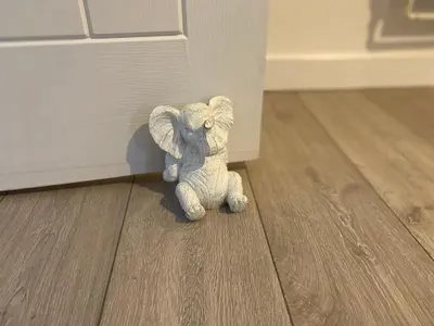 a small stuffed elephant standing on the floor at Stylish Home - Close to City Centre, Anfield Stadium - Free Parking in Litherland