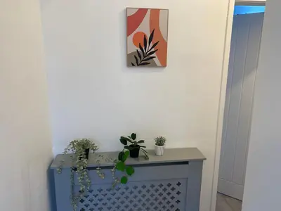 a table with potted plants on top of it at Stylish Home - Close to City Centre, Anfield Stadium - Free Parking in Litherland