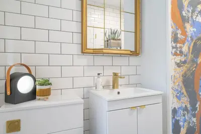 a bathroom with a sink and a mirror at Beautifully Designed 1 Bed Flat in Morecambe