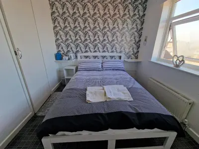 a bedroom with a bed with two towels on it at Number 40 in Blackpool