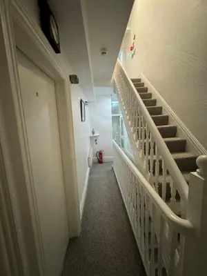 a hallway with stairs in a building at Number 40 in Blackpool