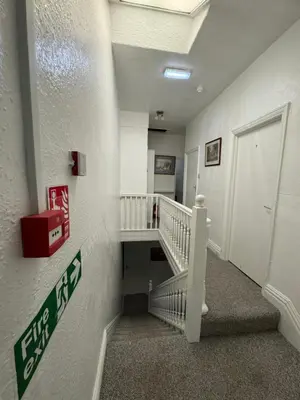 a hallway with a staircase in a building at Number 40 in Blackpool