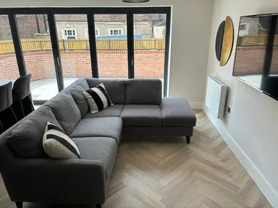 a living room with a couch and a chair at Pilgrim House by Phoenix Collection in Liverpool