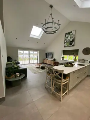 a kitchen and living room with a chandelier at Luxurious and Peaceful Lakeside House, Clitheroe in Clitheroe