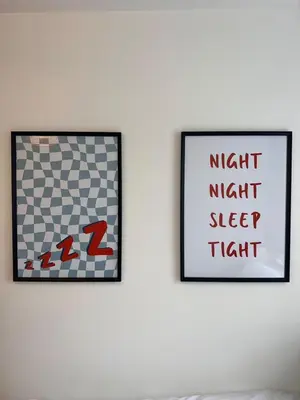 two pictures hanging on a white wall at Quaint 2Bed House near Wigan Centre in Ince-in-Makerfield