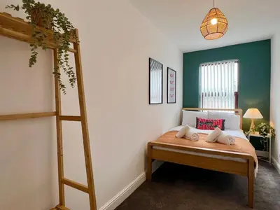 a bedroom with a bunk bed and a ladder at Quaint 2Bed House near Wigan Centre in Ince-in-Makerfield