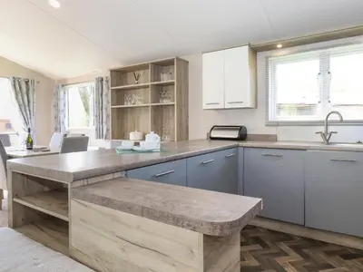 a kitchen with a large island in the middle at Coniston in Carnforth