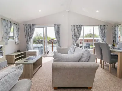 a living room with a couch and a table at Coniston in Carnforth