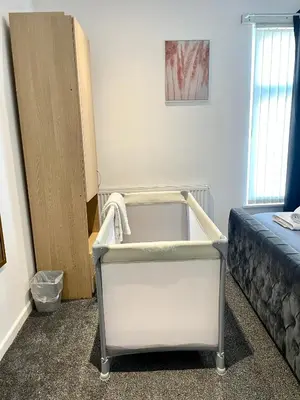 a room with a bed and a bath tub at Beautiful Entire House! in Liverpool