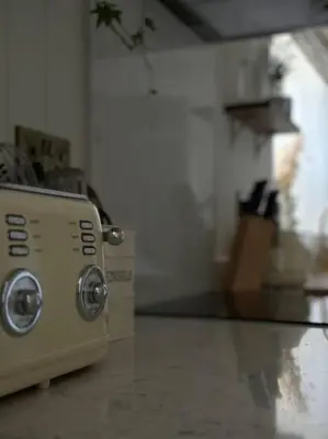 a toaster oven sitting on a counter in a kitchen at Drakes Cottage in Cartmel