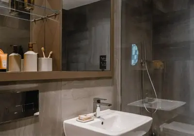 a bathroom with a sink and a mirror at Charles Hope Liverpool in Liverpool