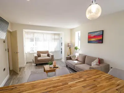 a living room with a couch and a table at Brynmar in Morecambe
