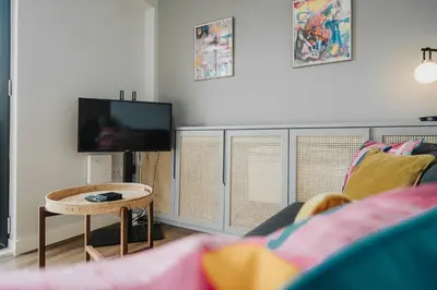 a living room with a couch and a tv at Chavasse Apartments, 1 Bed Studio, Parking - Pass the Keys in Liverpool