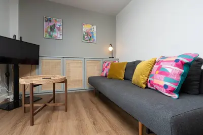 a living room with a couch and a table at Chavasse Apartments, 1 Bed Studio, Parking - Pass the Keys in Liverpool