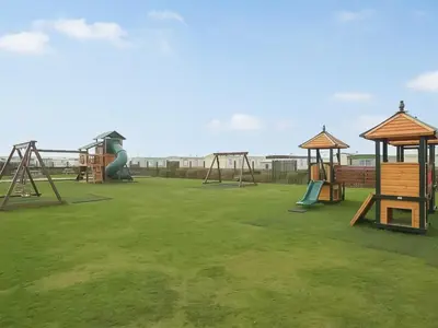 a group of playground equipment in a park at Sea Breeze in Heysham