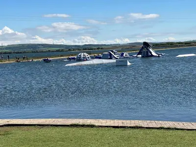 a plane sitting on the water in a lake at Lakes edge view in Millom