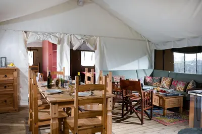 a room with a tent with a table and chairs at Bleasdale at Lantern and Larks in Chipping