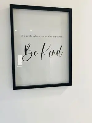 a framed picture of be kind on a wall at Rockley Green House - 3 Bedroom Home in Liverpool in Liverpool