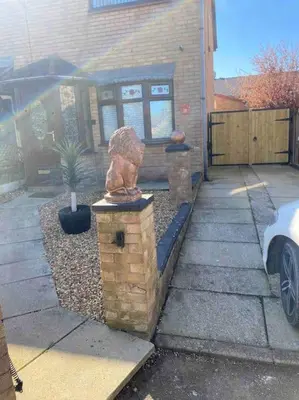 a statue sitting on top of a brick wall at Rockley Green House - 3 Bedroom Home in Liverpool in Liverpool