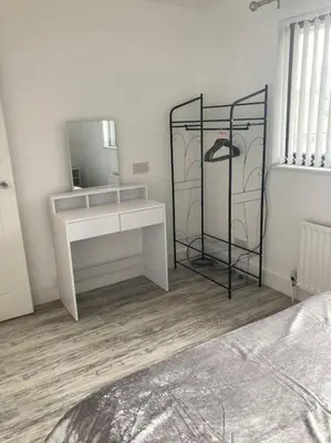 a bedroom with a white desk and a mirror at Rockley Green House - 3 Bedroom Home in Liverpool in Liverpool