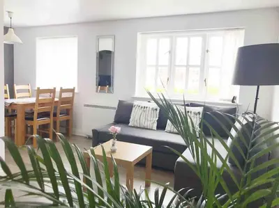 a living room with a couch and a table at Central Stylish 2Bedroom flat with free parking in Liverpool