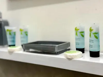 a counter with a shelf with products on it at Captivating 2-Bed Apartment in Liverpool in Liverpool