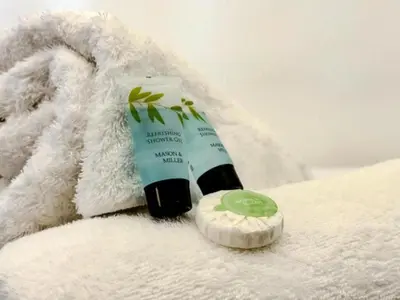 a tube of toothpaste sitting on a white towel at Captivating 2-Bed Apartment in Liverpool in Liverpool