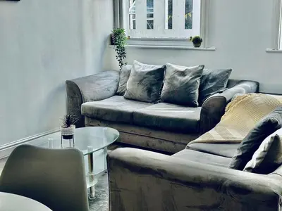 a living room with two couches and a table at Captivating 2-Bed Apartment in Liverpool in Liverpool