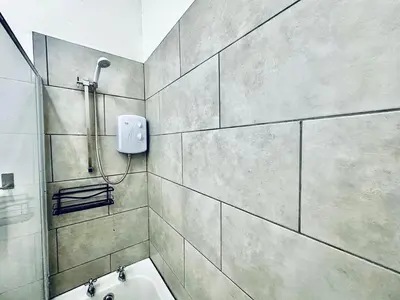 a bathroom with a shower and a sink at Captivating 2-Bed Apartment in Liverpool in Liverpool