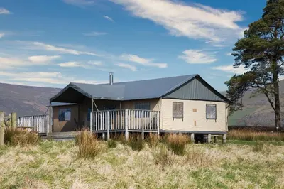 a house with a black roof on top of a field at Mallard - Bleasdale in Chipping