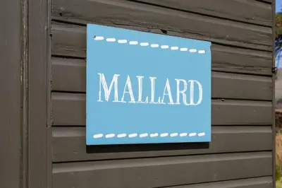 a sign on a wall with the word maligne at Mallard - Bleasdale in Chipping