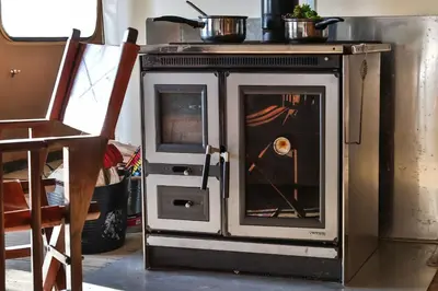 a stove with a door open in a room at Mallard - Bleasdale in Chipping
