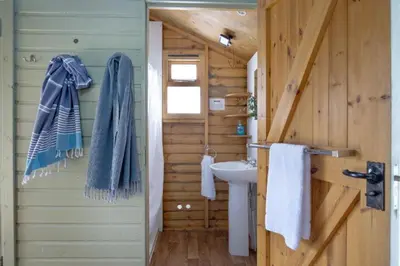 a bathroom with a sink and a toilet in a cabin at Mallard - Bleasdale in Chipping