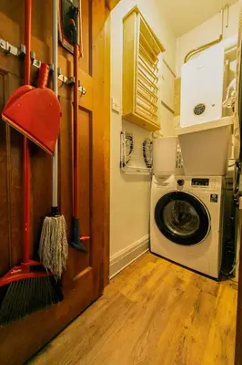 a laundry room with a washing machine and a washer at 107a - 3 Double Bedrooms in Lytham St Annes