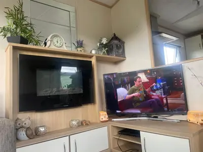 a large flat screen tv in a living room at 147a Port Haverigg in Millom
