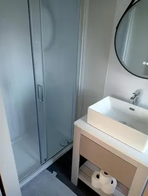 a bathroom with a sink and a shower at Lake View Lodge in Lytham St Annes