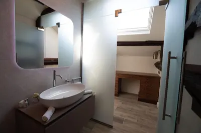 a bathroom with a sink and a mirror at Aynsome Manor in Cartmel