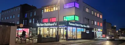 a building with colorful lights on the side of it at Haven Heights International in Blackpool
