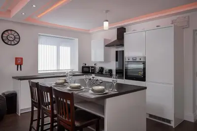 a kitchen with a large island with a counter top at Haven Heights International in Blackpool