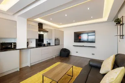 a living room with a couch and a table at Haven Heights International in Blackpool