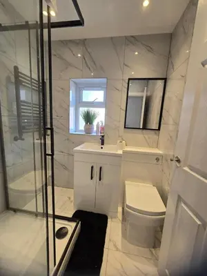 a bathroom with a toilet and a sink and a shower at Seaside Retreat on Fleet Street in Blackpool