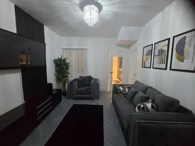 a living room with a couch and a chair at Seaside Retreat on Fleet Street in Blackpool