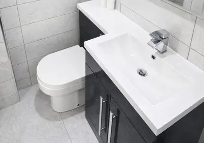 a bathroom with a white toilet and a sink at Williamson Suites - Apartment 1 in Liverpool