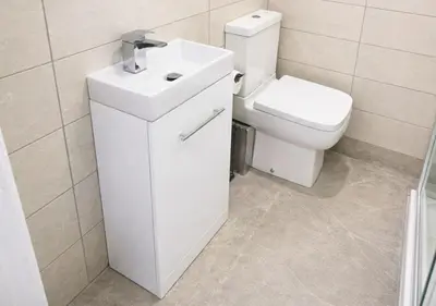 a white bathroom with a toilet and a sink at Williamson Suites - Apartment 1 in Liverpool