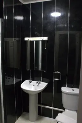 a bathroom with a sink and a toilet at Glen Allan Hotel in Blackpool