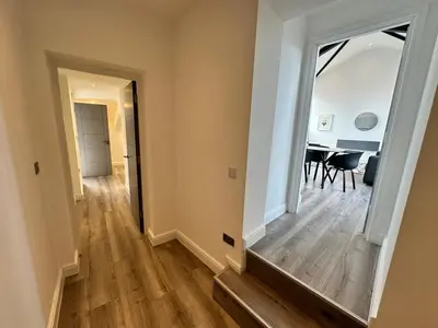 a hallway with a mirror and a dining room at Dale Street Apartments Liverpool by Beehosting in Liverpool