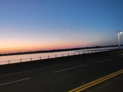 a highway with a street light next to a body of water at Lakeside View in Southport